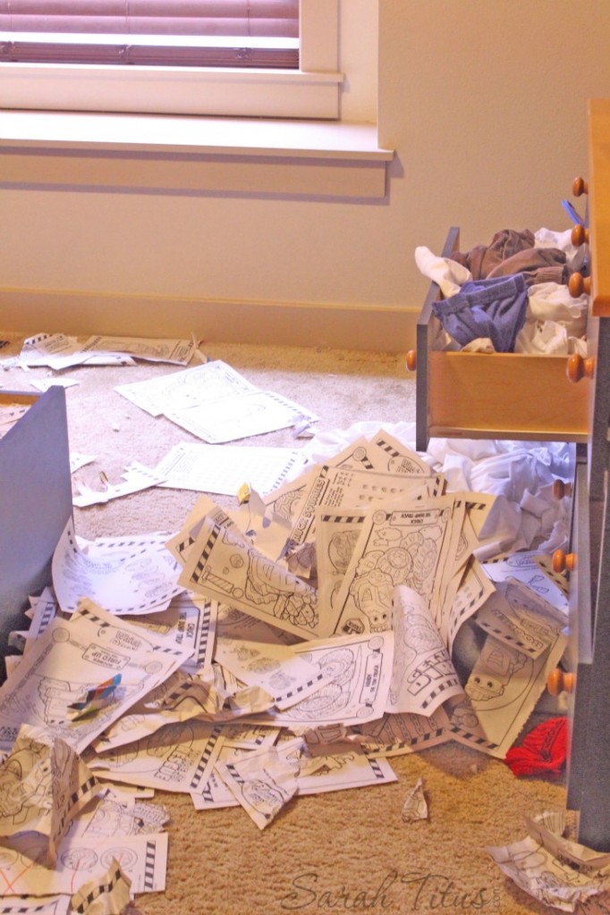 Kid's room with coloring pages on the floor