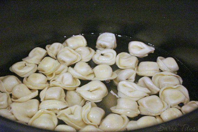 Pasta cooking in a pan of boiling water