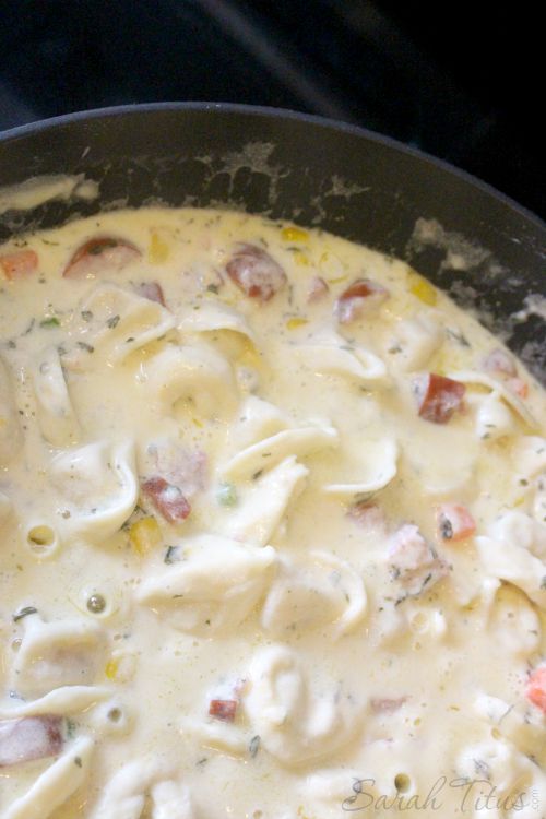 Well mixed and cooked Alfredo Pasta in a large pan