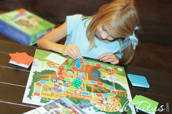Little girl playing a board game