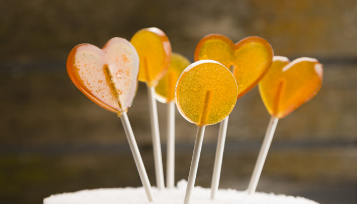 Golden colored heart shaped Easy Honey Lollipops