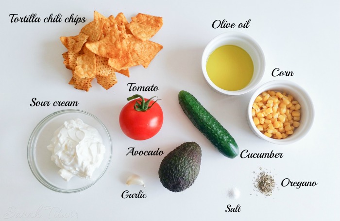 Tzatziki Sauce ingredients: tortilla chili chips, olive oil, corn cucumber, oregano, salt, garlic, avocado, tomato and sour cream