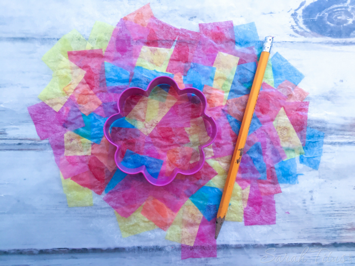 These tissue paper suncatchers are so fun to make and they keep the little ones entertained for hours! Put ribbon on the ends and fly them around the house like a kite!