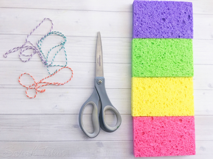 Supplies for sponge bombs: twine, scissors and multi colored sponges