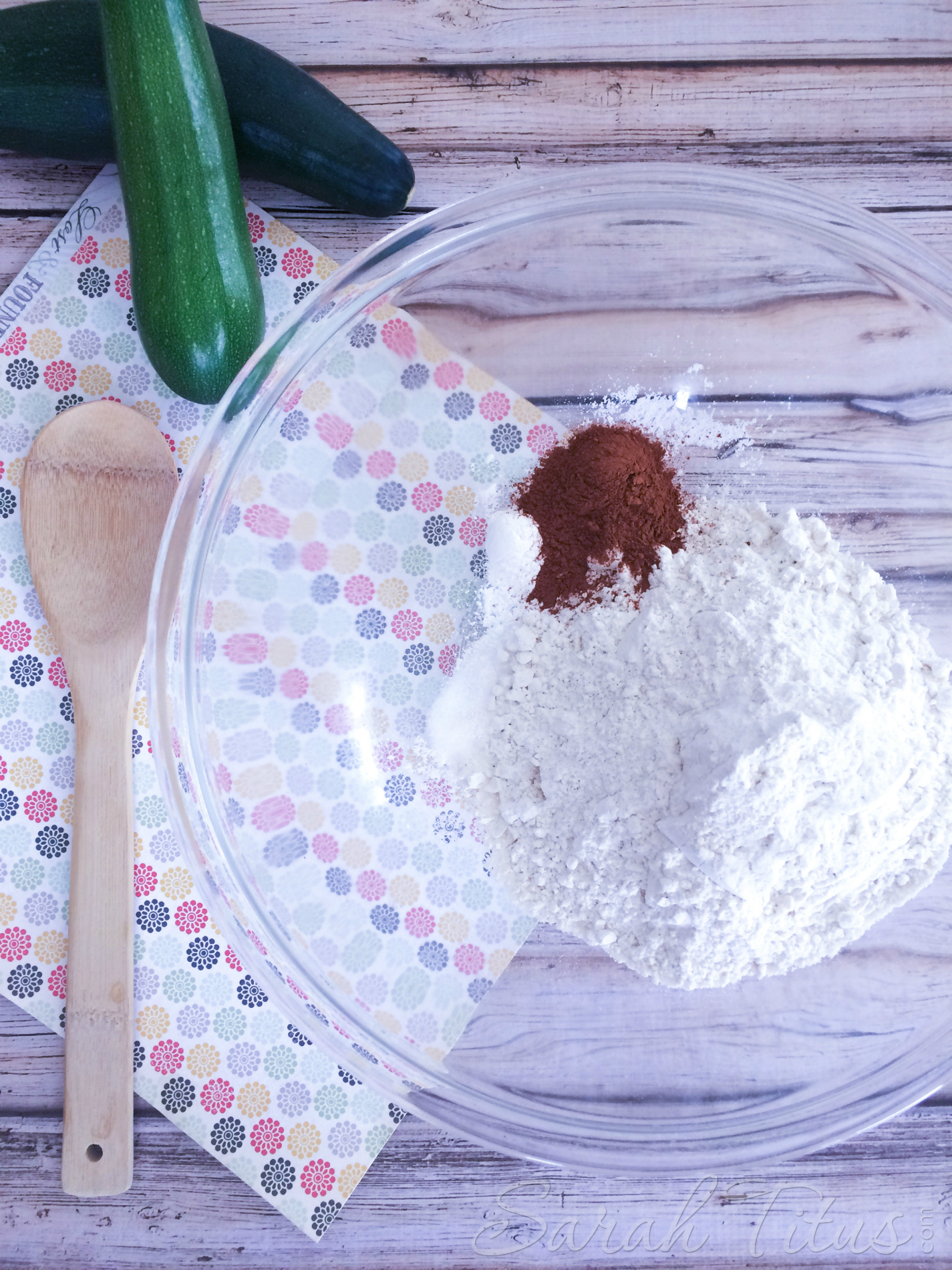 Adding other dry ingredients to a bowl for Zucchini Bread