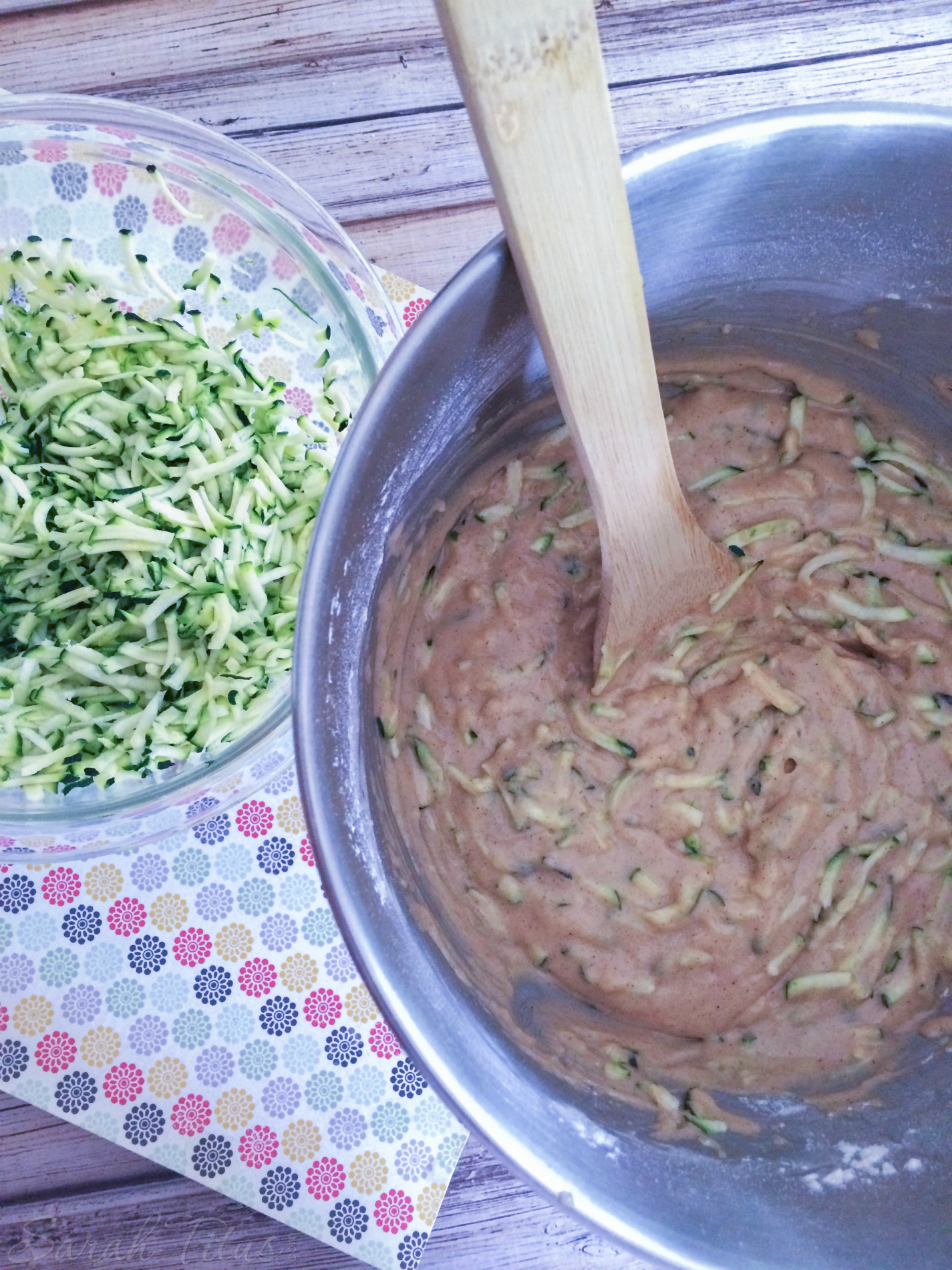 Adding the shredded zucchini to the bread batter