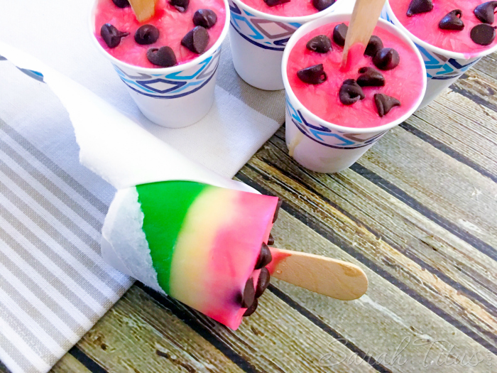 Frozen Watermelon Pudding Pops sitting on a table in Dixie cups