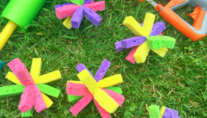 DIY Sponge bombs and water guns lying in the grass