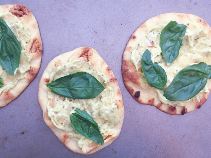 Laying the basil leaves on top of the mayo mixture