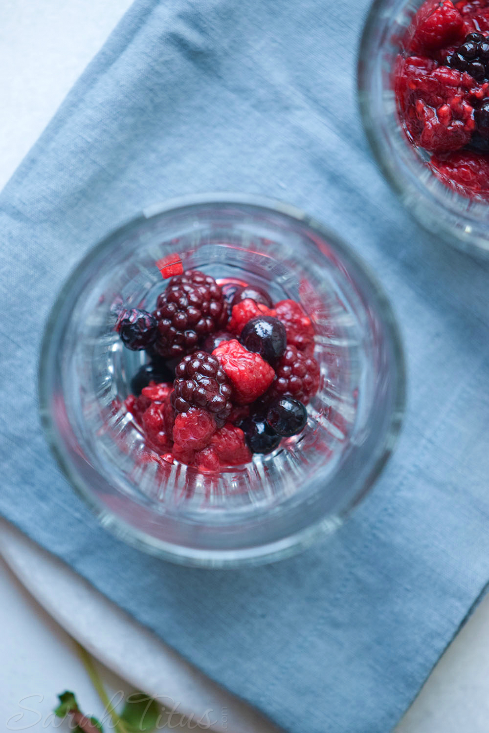 Raspberries, blueberries, and blackberries in bottom of glasses for Very Berry Ice Cream Float