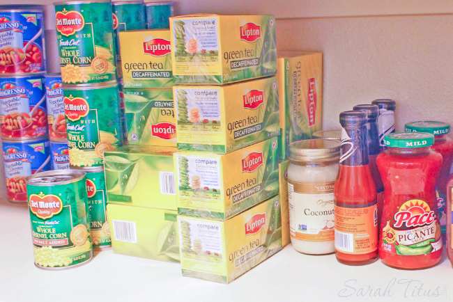 Pantry with groceries including lots of Lipton green tea boxes