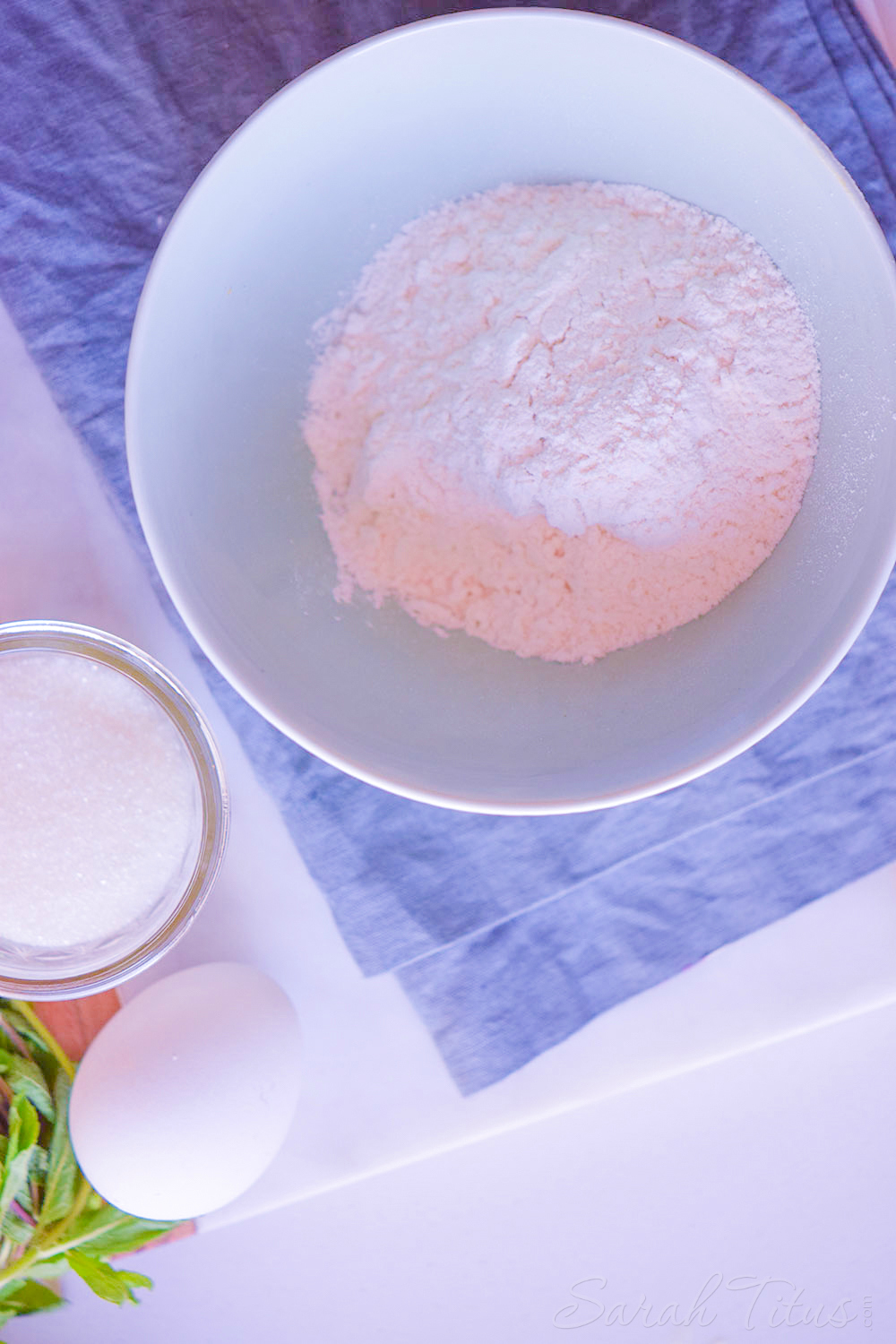 Mixing together the all-purpose flour, sugar, salt, and baking powder in a large bowl.