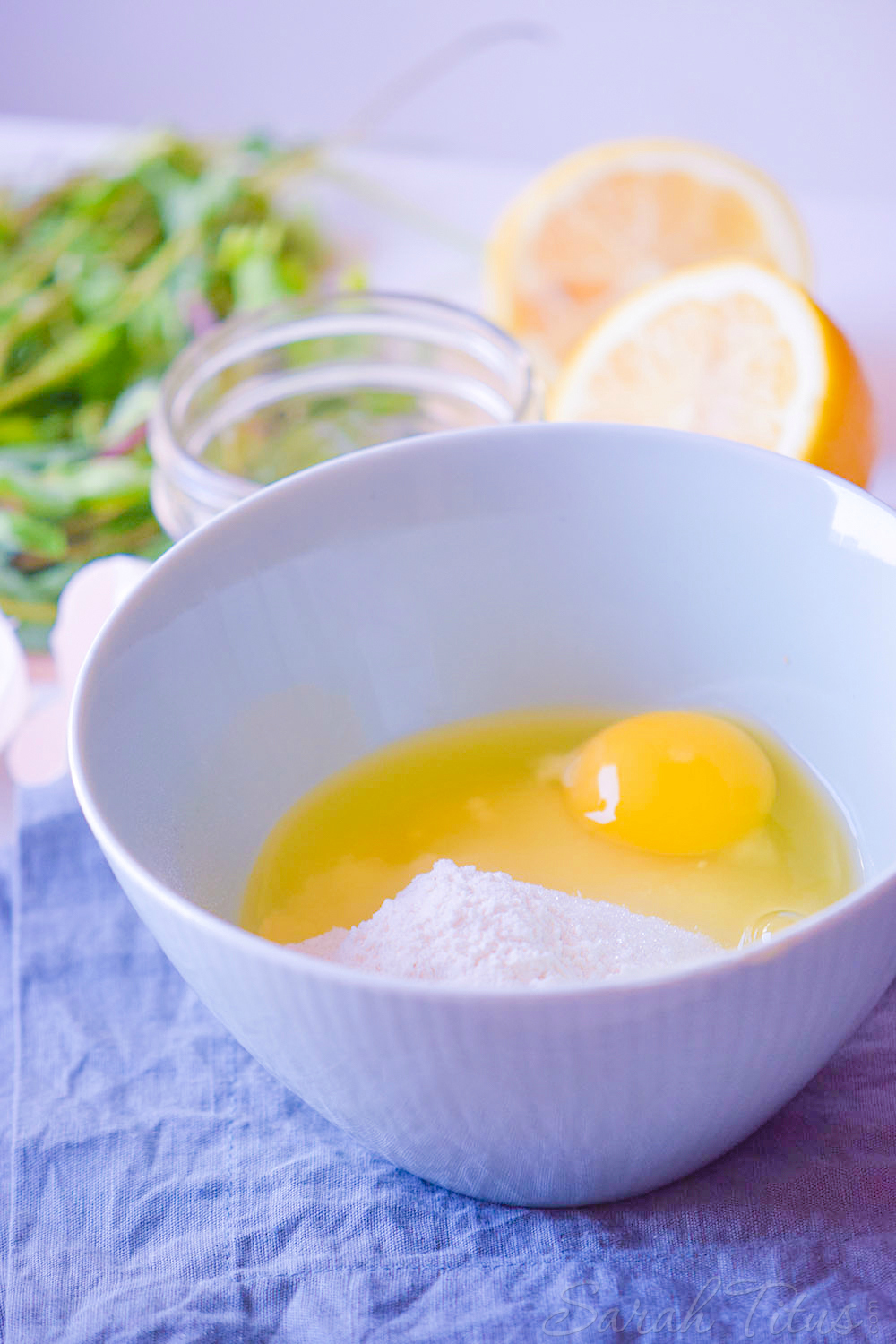 Egg and flour in white bowl