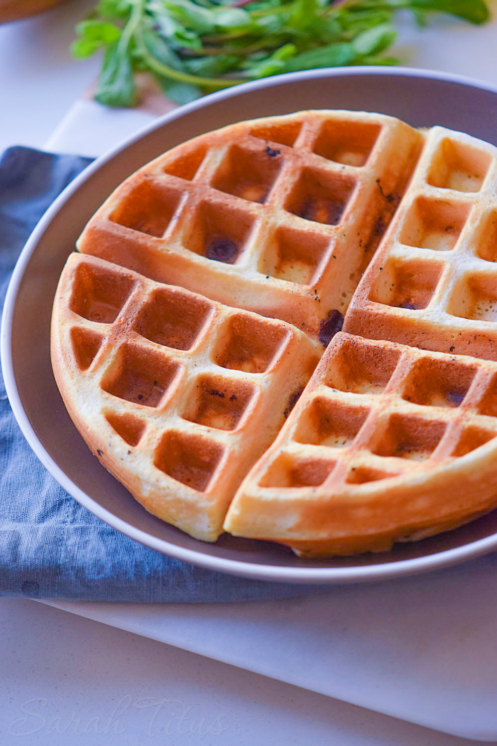 Finished crispy waffle on a silver plate