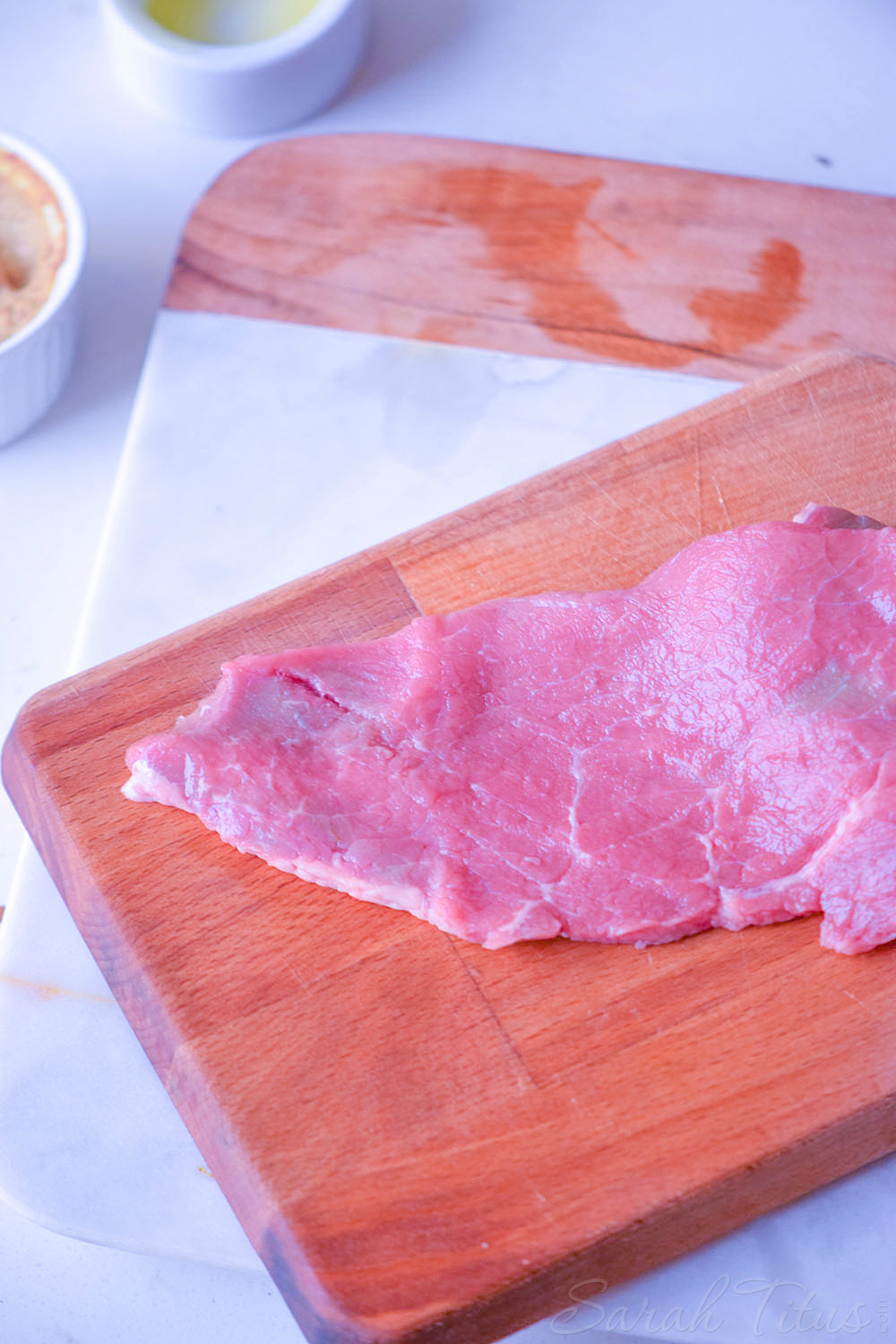 Sliced beef on a cutting board for the Italian bowl