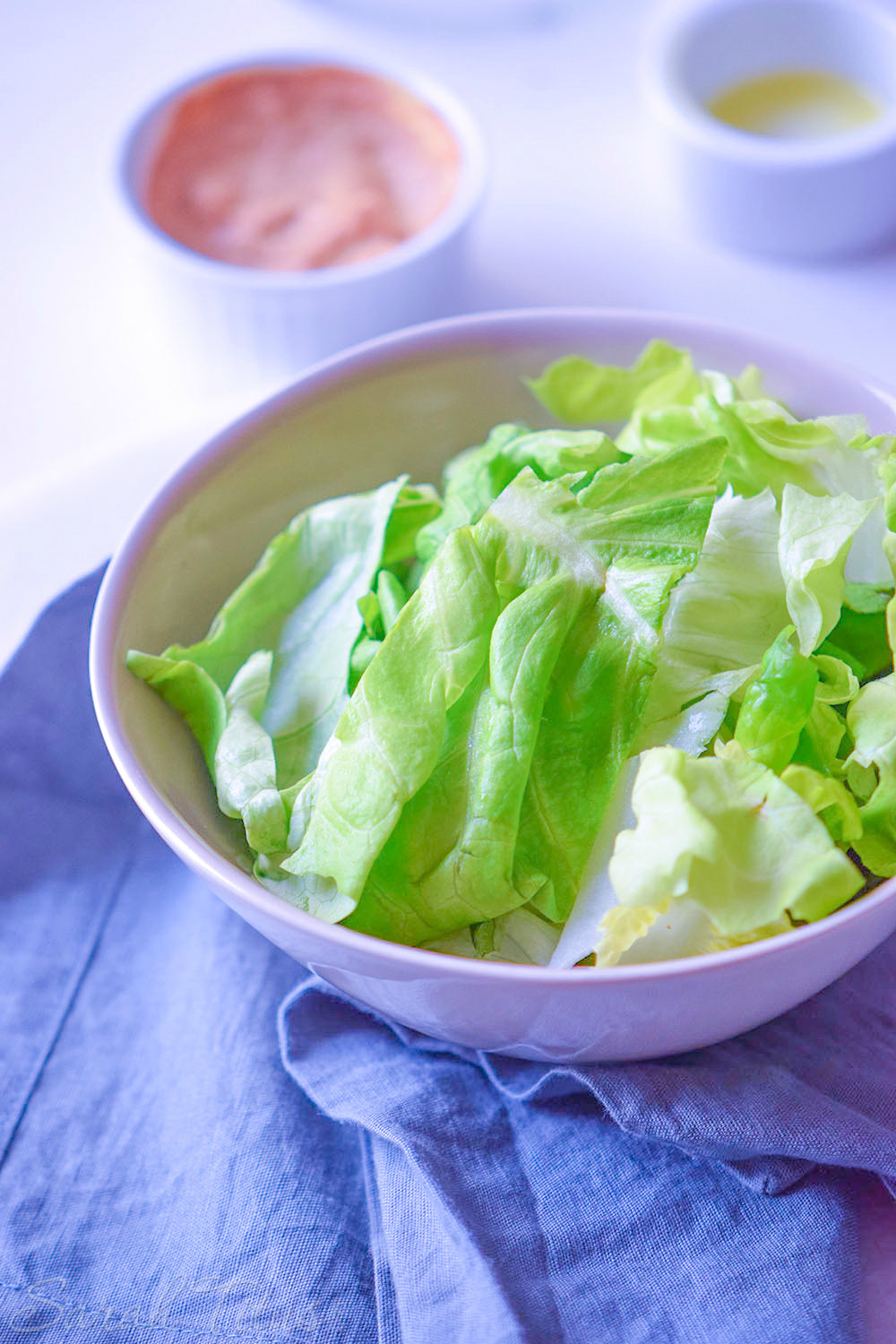 Lettuce leaves for the Italian bowl in a white bowl