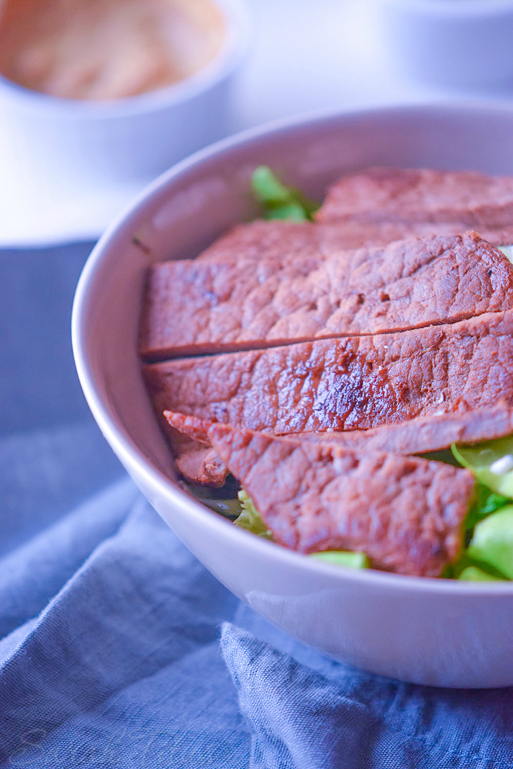 Lettuce, pita and steak in a bowl for the Italian bowl