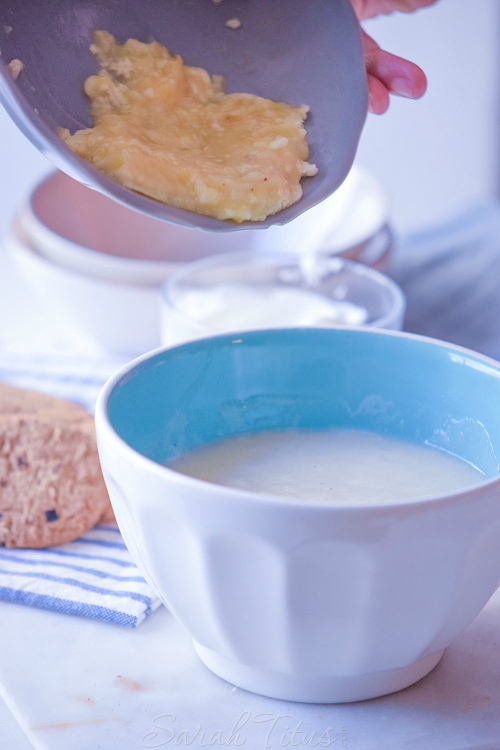 Adding the mashed banana mixture to the cream cheese, cinnamon, and sugar.