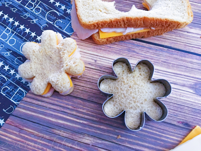 The finished little flowered shaped cookie cutter turkey and cheese sandwiches