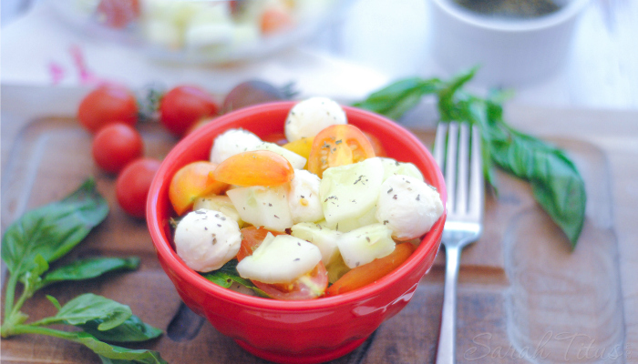 This Cucumber and Tomato Caprese Salad marries the flavors of tomato, basil, and mozzarella cheese together perfectly. This is one salad recipe you won't want to miss!