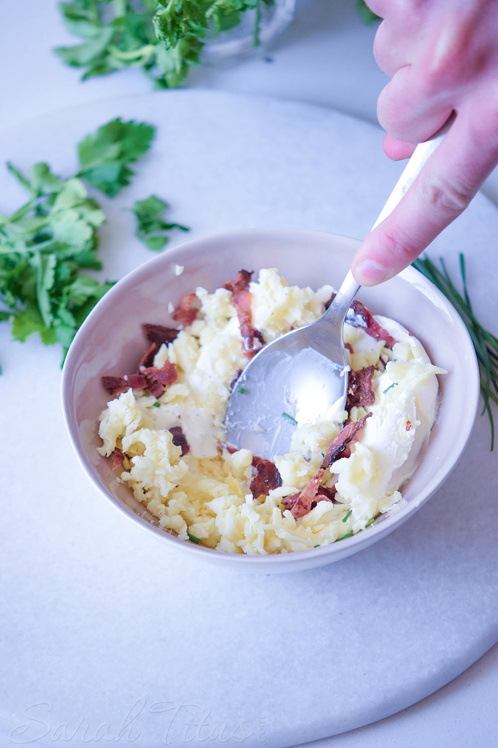 Mini Stuffed Potato Bites - Giving the chives, bacon, cream cheese, mozzarella cheese and garlic cloves a good stir