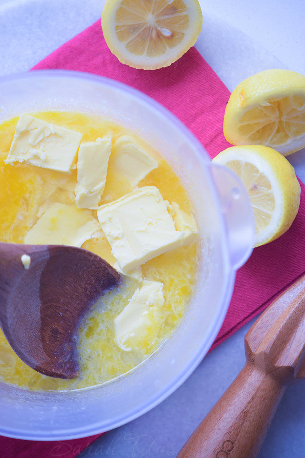 Adding butter for the lemon poppy muffins to the other liquid ingredients