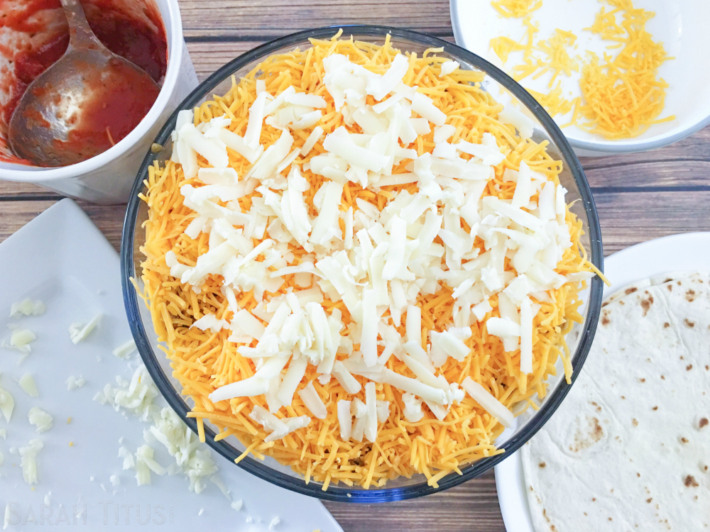 Repeating thin layers of hamburger, salsa, cheese and tortillas till oven safe bowl is full