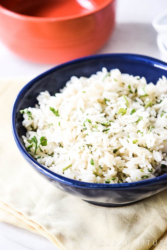 Rice is a great inexpensive side to add your dinner, but it is often bland and boring. This Lime Cilantro Rice is neither bland, nor boring and will have your family asking you to make more of it!