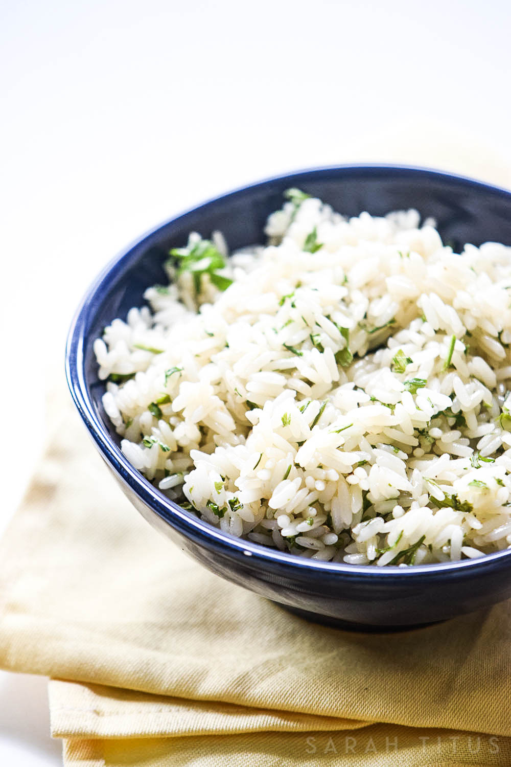 Rice is a great inexpensive side dish to add your dinner, but it is often bland and boring. This Lime Cilantro Rice is neither bland, nor boring and will have your family asking you to make more of it!