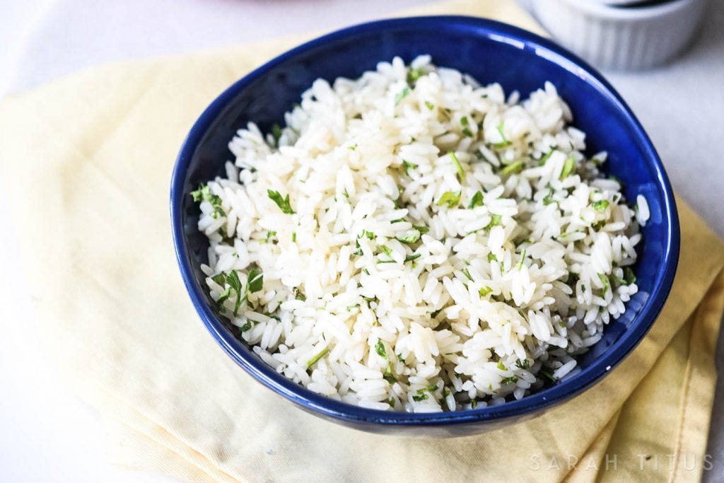 Rice is a great inexpensive side dish to add your dinner, but it is often bland and boring. This Lime Cilantro Rice is neither bland, nor boring and will have your family asking you to make more of it!