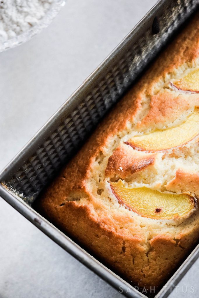 This Yogurt Peach Cake is delicious for dessert or breakfast! It is made with Greek yogurt; so you get your fruit, protein, and calcium!