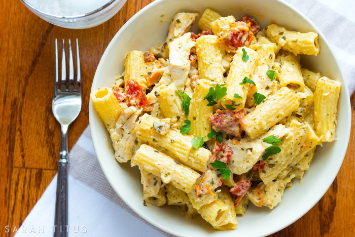 Chicken dishes are a staple for dinner. When you add pesto and pasta to the equation, you have a celebration for dinner! You have to try this scrumptious Creamy Pesto Chicken Pasta! #Chicken #ChickenAndPasta #Pasta #Pesto #DinnerIdeas