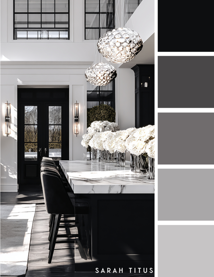 Modern black and white kitchen bar island with marble countertops, black stools, silver pendant lights, white hydrangeas, and black framed doors in a luxe gray and silver palette.