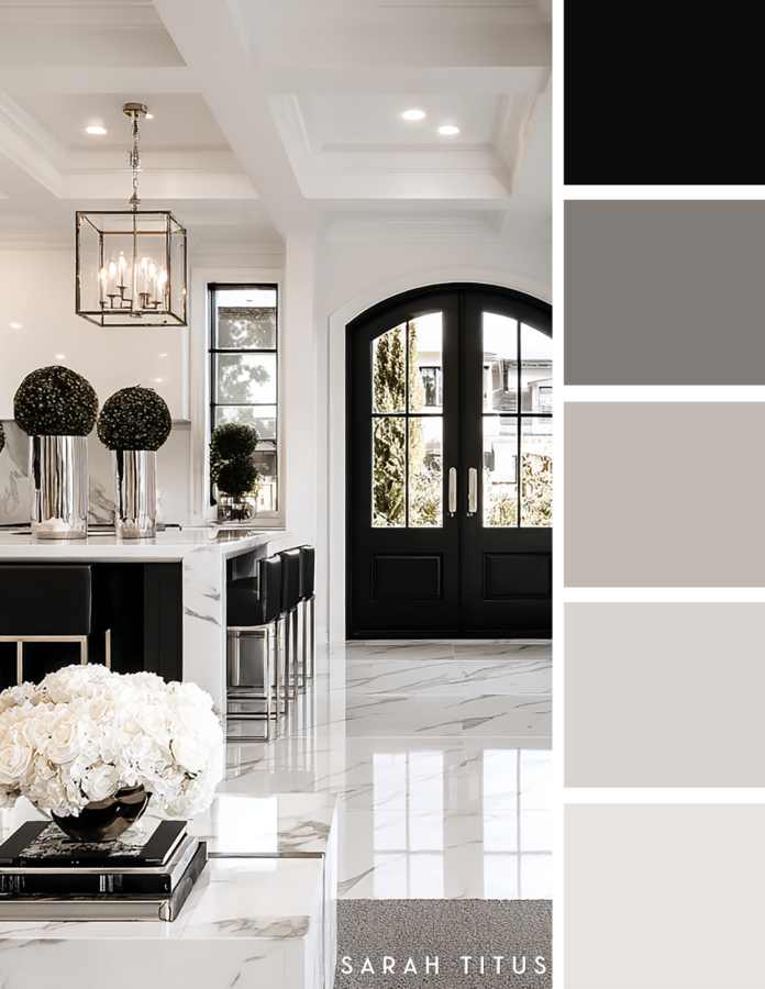 Bright luxury kitchen with a marble island, black cabinetry, chrome lantern light, white floral arrangements, and black arched doors in a black, white, and silver color palette.